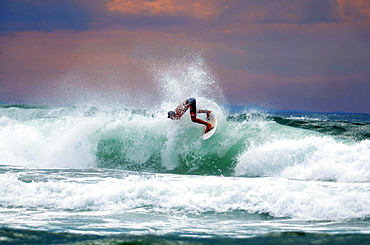 Sunset surfing on Cote des Basques beach, Biarritz