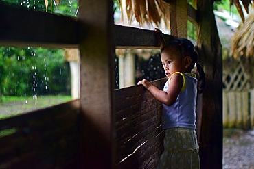 Portrait of a Bribri young girl (Adriana) inside a cottage, A day with the Bribri, indigenous people in Lim?n Province of Costa Rica