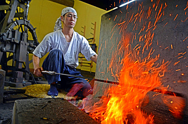 Japanese Swordsmith, Muneyasu, working at his studio in Saitama, Japan. He is part of the new generation of talented katana makers.