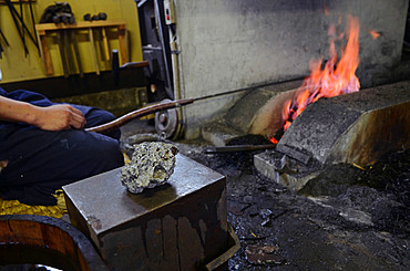 Japanese Swordsmith, Muneyasu, working at his studio in Saitama, Japan. He is part of the new generation of talented katana makers.