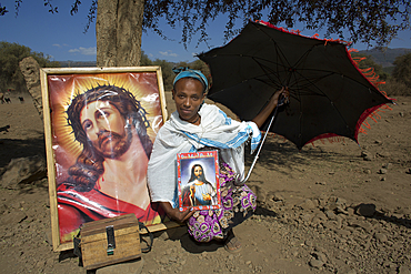 ethiopian woman asking for a contribution to the local church