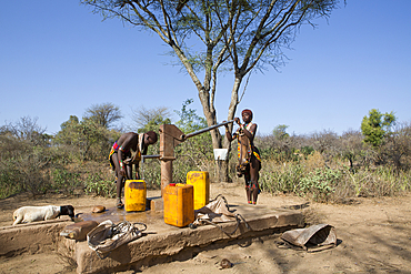 girls of the Hamer tribe fetching water