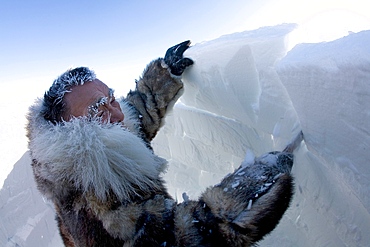 Building an igloo in Gojahaven, an Inuit settlement in the far north of Canada