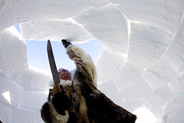 Building an igloo in Gojahaven, an Inuit settlement in the far north of Canada