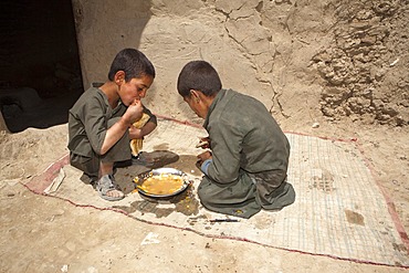 Afghan student gets food at school.