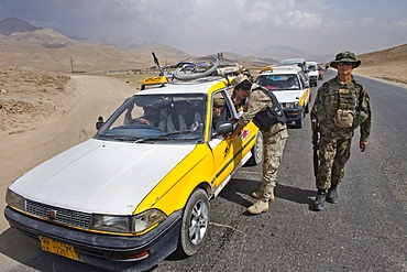 Afghan police and military checkpoint looking for suspected terrorists, just outide Maidan city.