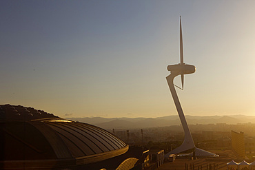 At right Torre Telefonica by architect Santiago Calatrava and at left Palau Sant Jordi sports arena by Arata Isozaki. Montjuic, Barcelona, Spain, Europe