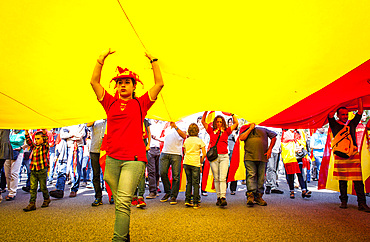 Anti-independence Catalan protestors carry Spanish flag during a demonstration for the unity of Spain on the occasion of the Spanish National Day at Passeig de Gracia, Barcelona on October 12, 2014, Spain