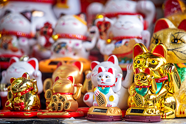 Maneki-neko statues for sale at a store, Shanghai, China