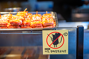 A sign saying no rats allowed in a restaurant, Shanghai, China.