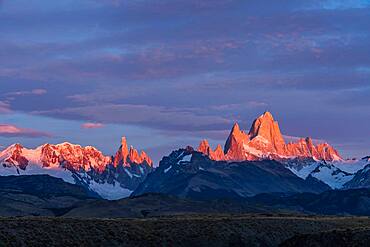 First light on Mount Fitz Roy and Cerro Torre in Los Glaciares National Park near El Chalten, Argentina.  A UNESCO World Heritage Site in the Patagonia region of South America.