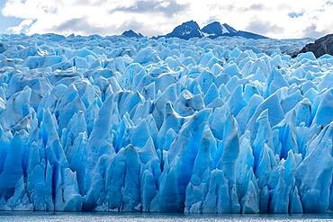 The jaggedly sculpted face of the Grey Glacier on Lago Grey in Torres del Paine National Park, a UNESCO World Biosphere Reserve in Chile in the Patagonia region of South America.