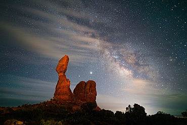 Saturn, Jupiter and the Milky Way over Balanced Rock in Arches National Park near Moab, Utah.