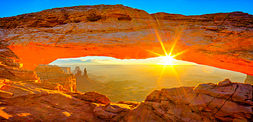 Mesa Arch at sunrise with the Washer Woman Arch, Monster Tower & Airport Tower. Canyonlands National Park, Utah.