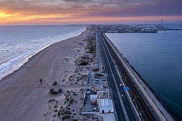 Cadiz in Background. Aerial view of the beach and road CA-33 also called AV V�a Augusta Julia, from San Fernando to Cadiz, Cadiz province, Andalucia, Spain