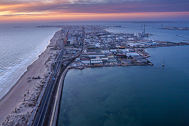 Cadiz in Background. Aerial view of the beach and road CA-33 also called AV V�a Augusta Julia, from San Fernando to Cadiz, Cadiz province, Andalucia, Spain