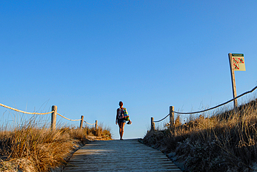 Young woman walking in Levante Beach - Platja de Llevant -, Formentera