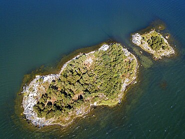 Aerial view of small island in front Mossala Island Resort Southwest Finland archipielago. The archipelago ring road or Saariston rengastie is full of things to see, do and do. The Archipelago Trail can be taken clockwise or counter clockwise, starting in the historical city of Turku, and continuing through rural archipelago villages and astonishing Baltic Sea sceneries. The Trail can be taken from the beginning of June until the end of August.