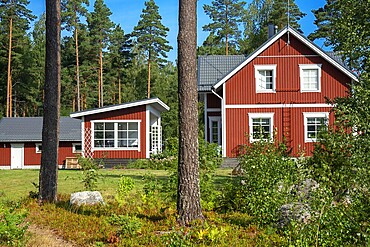 Typical wooden house in in Nagu village or Nauvo island in Väståboland in Pargas in Southwest Finland Turku archipelago. The archipelago ring road or Saariston rengastie is full of things to see, do and do. The Archipelago Trail can be taken clockwise or counter clockwise, starting in the historical city of Turku, and continuing through rural archipelago villages and astonishing Baltic Sea sceneries. The Trail can be taken from the beginning of June until the end of August.