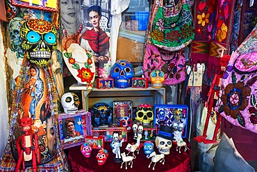 Colorful Mexican ceramic skulls or calaveras and Frida Kahlo souvenirs in Playa del Carmen, Riviera Maya, Quintana Roo, Mexico