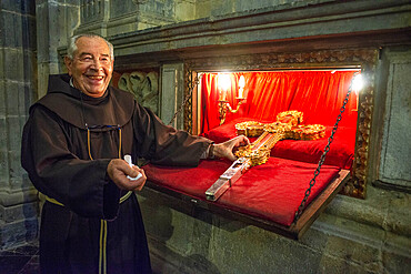 A monk at the monastery Santo Toribio in northern Spain gets out the holy relic, said to be part of the cross on which Jesus died Inside Santo Toribio de Liebana monastery. Liébana region, Picos de Europa, Cantabria Spain, Europe