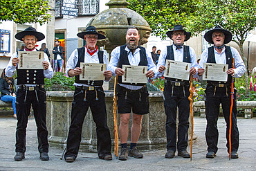 A group of pilgrims in the old Town, Santiago de Compostela, UNESCO World Heritage Site, Galicia, Spain.