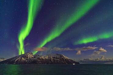 A fine display of aurora in curtains across the north, October 19, 2019, observed from the upper Deck 9 of the ms Trollfjord on the southbound voyage north of Tromsø along the Norwegian coast. Illumination is partly from the waning gibbous Moon.