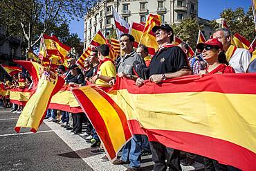 Anti-independence Catalan protestors carry Spanish flags and catalan flags during a demonstration for the unity of Spain on the occasion of the Spanish National Day at Passeig de Gracia, Barcelona on October 12, 2014, Spain