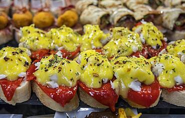 Pintxos, area of bars and restaurants, in La Ribera market, Bilbao, Spain