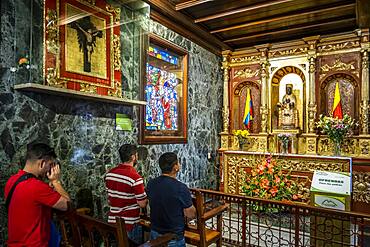 Santuario del Senor de Monserrate, people praying to Morena virgin from Montserrat or Moreneta, Church, Bogota, Colombia