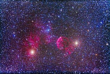 The supernova remnant IC 443 in Gemini near the stars Mu (left) and Eta (right) Geminorum. Slight haze passing thru on some exposures added the star glows.