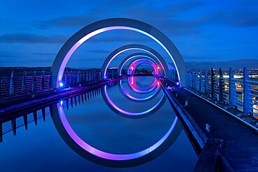 The Falkirk Wheel on the Union Canal illuminated at night, Falkirk, Stirlingshire, Scotland, United Kingdom, Europe