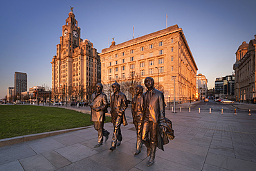 The Beatles Statue and Royal Liver Building at sunset, Pier Head, Liverpool Waterfront, Liverpool, Merseyside, England, United Kingdom, Europe