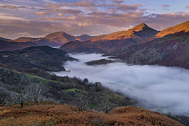 First Light on Yr Aran and a fog filled Nant Gwynant Valley, Nant Gwynant, Eryri, Snowdonia National Park, North Wales, United Kingdom, Europe