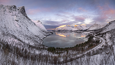 View from the Bergsbotn Viewing Platform overlooking Bergsfjorden or Bergsfjord and the Bergsbotn mountain range at dawn in winter, Senja, Troms og Finnmark County, Norway, Scandinavia, Europe