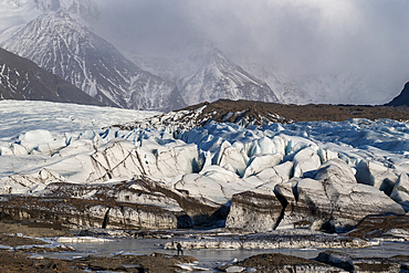 A Photographer shoots the Rapidly Receeding Svínafellsjökull Glacier, a tongue of the Vatnajokull Glacier, Southern Iceland, Europe