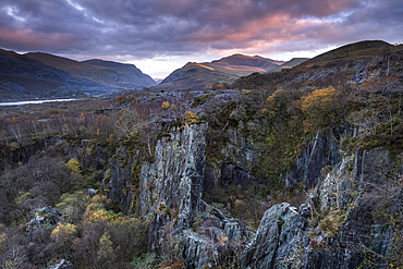 Glyn Rhonwy Abandoned Slate Quarry, Mount Snowdon and the Llanberis Pass at sunset, Snowdonia National Park, Eryri, North Wales, UK