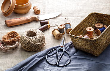 Sewing threads with needles and scissors on a canvas, Uzbekistan, Central Asia, Asia