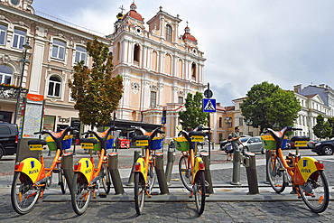 Bike self-service station in front of the Church of St. Casimir, Vilnius, Lithuania, Europe