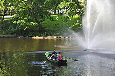 Rowing on the Pilsetas Canal surrounding the Old Town, Riga, Latvia, Baltic region, Europe