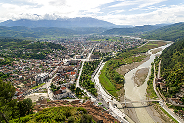 View looking over city centre of Berat in valley of River Osum with mountains beyond, Berat, Albania, Europe