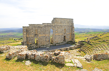 Remains of Roman theatre stage background wall and seating area, Acinipo Roman town site, Ronda la Vieja, Cadiz province, Andalusia, Spain, Europe