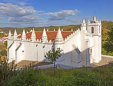 Architectural details of conical roof decorations on historic whitewashed church of Igreja Matriz in medieval village of Mertola, Baixo Alentejo, Portugal, Europe