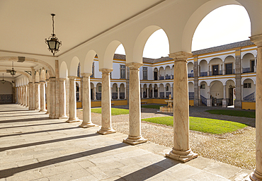 Cloisters collonade marble columns, historic courtyard of Evora University, Evora, UNESCO World Heritage Site, Alto Alentejo, Portugal, Europe