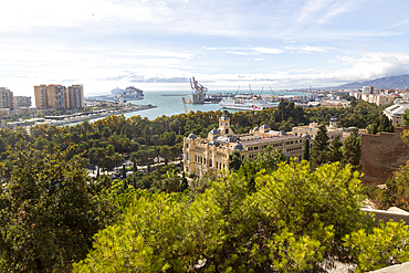 Cityscape view over city centre and dock area with Trasmediterranea ferry in port, and city hall (Ayuntamiento) in centre, Malaga, Andalusia, Spain, Europe