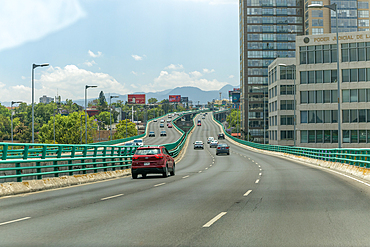 View through car windscreen of dual carriageway, Anillo Perifique elevated road, Alvaro Obregon municipality, Mexico City, Mexico, North America