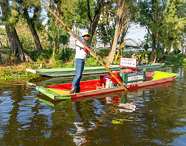 Boat selling Micheladas and Pulque at popular tourist attraction boating, Xochimiloco, Mexico City, Mexico, North America