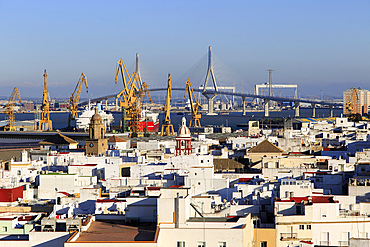 Rooftops of buildings looking towards the port and new bridge from cathedral roof, Cadiz, Spain