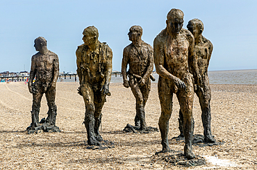 'Walking Men' artwork bronze sculptures by Laurence Edwards, South Beach, Lowestoft, Suffolk,England, UK July 2024