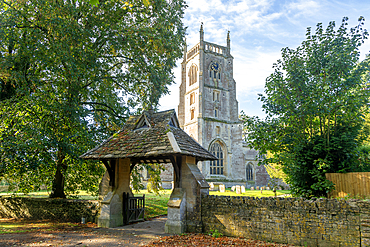 Lychgate and tower of village parish church of Saint Mary, Kempsford, Gloucestershire, England, UK